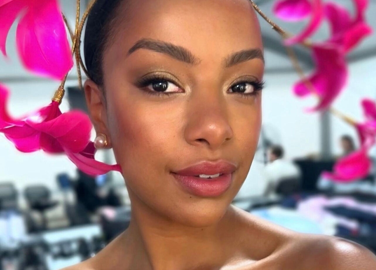 Woman with stylish pink floral headpiece at Spring Racing Carnival Bookings - PRAHRAN, Prahran, Victoria, AU.