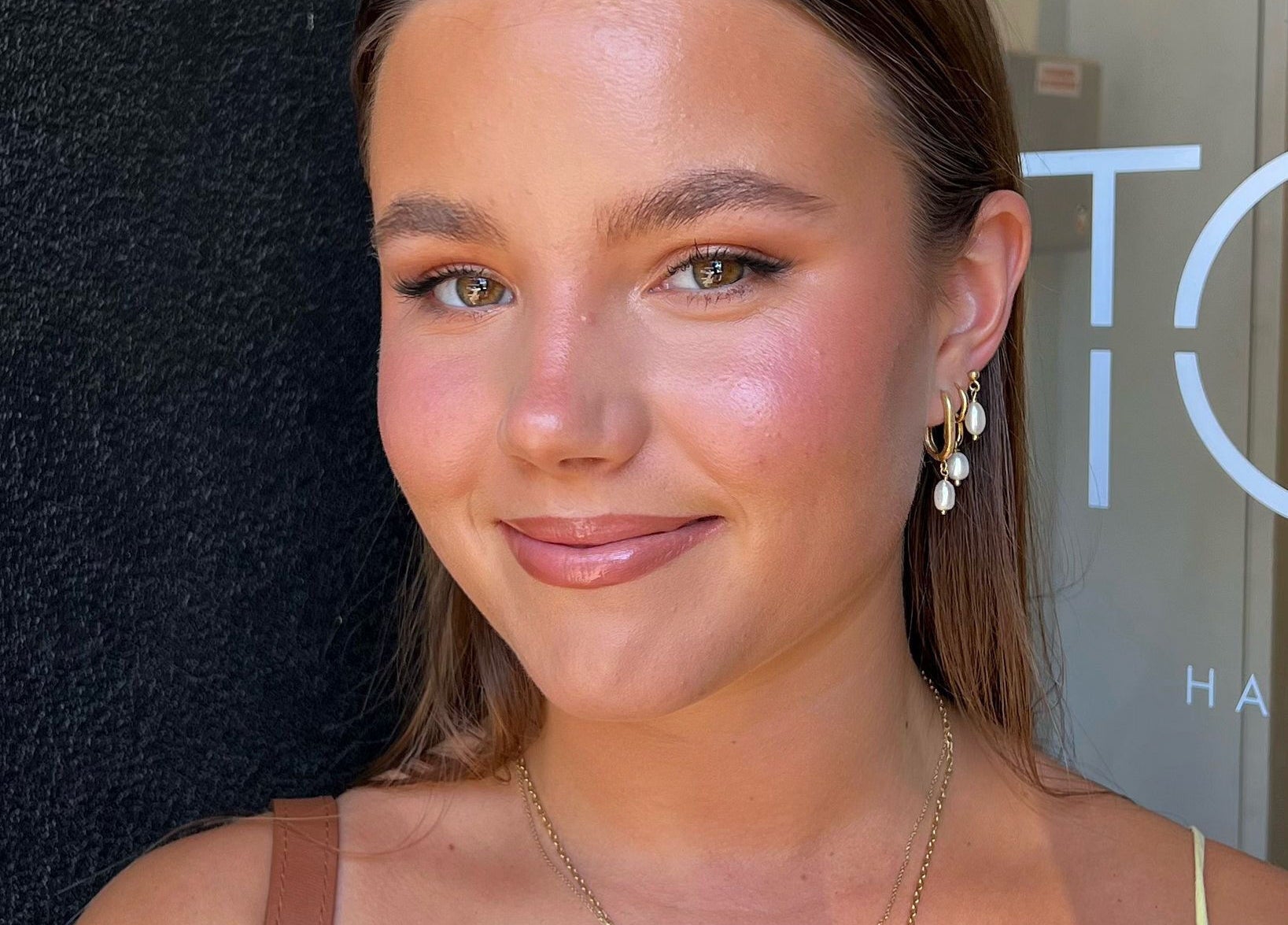 Close-up of a person with radiant skin, perfect for Spring Racing Carnival Bookings - PRAHRAN, Prahran, Victoria, AU.