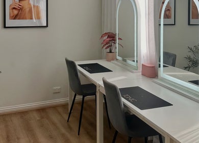 Modern beauty workstation at Tonic Studio - Hair & Makeup in Prahran, Victoria, AU with mirrors and chairs.