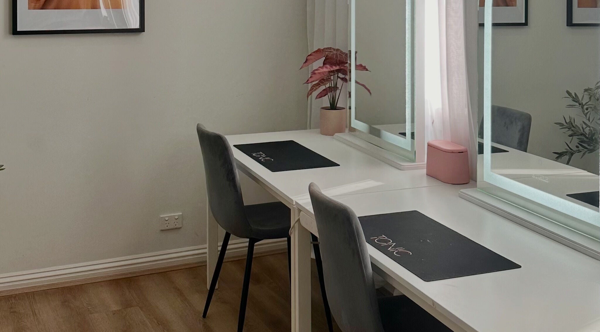 Modern beauty workstation at Tonic Studio - Hair & Makeup in Prahran, Victoria, AU with mirrors and chairs.