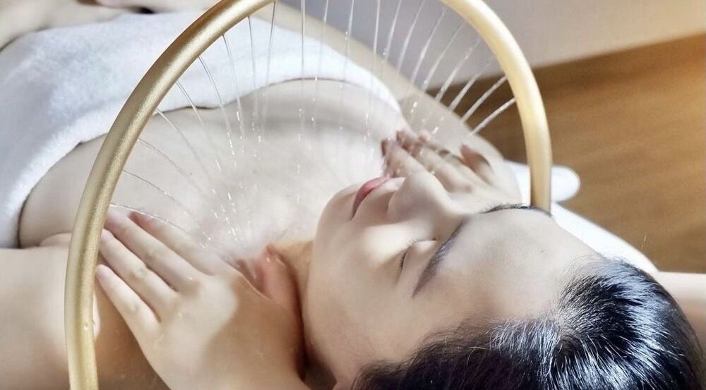 Relaxing facial massage at Bablabeau Heads Spa, Batu Caves, Selangor, MY, highlighted by soothing water streams.