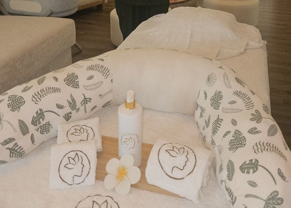 Relaxing massage setup at Empress Balinese Massage - Home Service, Dubai, Dubai, AE, featuring towels and lotion.