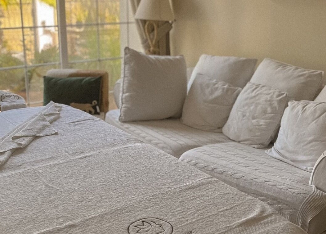 Relaxing massage setup at Empress Balinese Massage - Home Service, Dubai, Dubai, AE, with cozy white sofas.