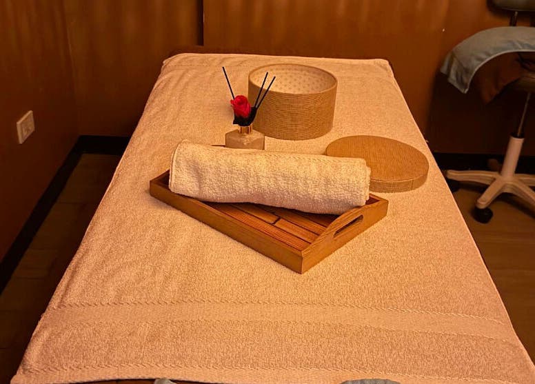 Relaxing massage table setup at Turquesa Massage and Spa in Makati, Metro Manila, PH with towel and decor.