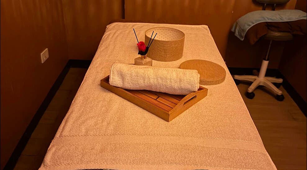 Relaxing massage table setup at Turquesa Massage and Spa in Makati, Metro Manila, PH with towel and decor.
