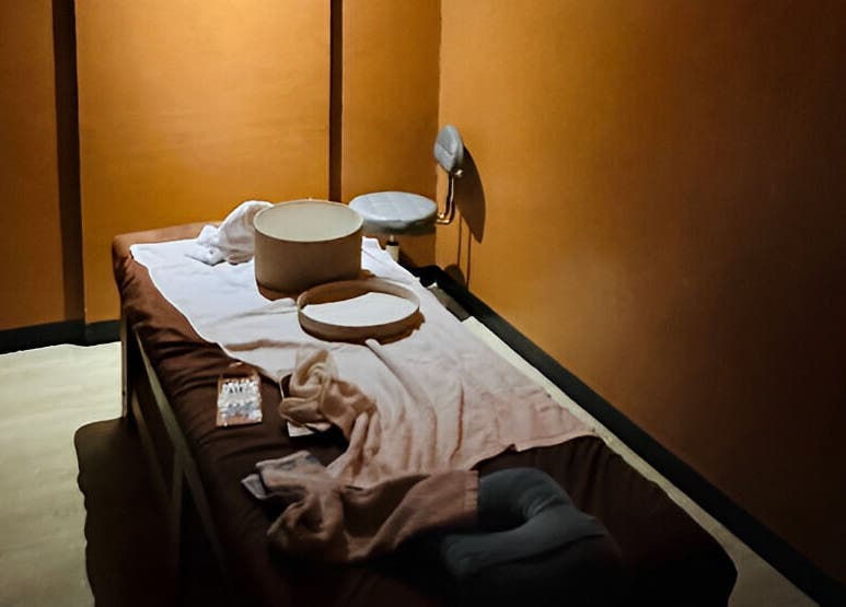 Relaxing massage room at Turquesa Massage and Spa, Makati, Metro Manila, PH, featuring a cozy ambiance.