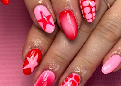 Stylish pink and red nail art at Beauty by Lauren F, Belfast, Northern Ireland, GB.