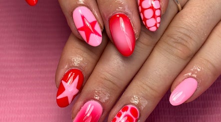 Stylish pink and red nail art at Beauty by Lauren F, Belfast, Northern Ireland, GB.