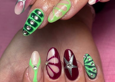 Intricate nail art with green and burgundy designs at Beauty by Lauren F, Belfast, Northern Ireland, GB.