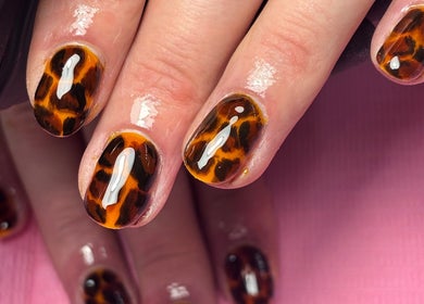 Tortoiseshell nail design by Beauty by Lauren F, Belfast, Northern Ireland, GB. Close-up of hands with glossy finish.