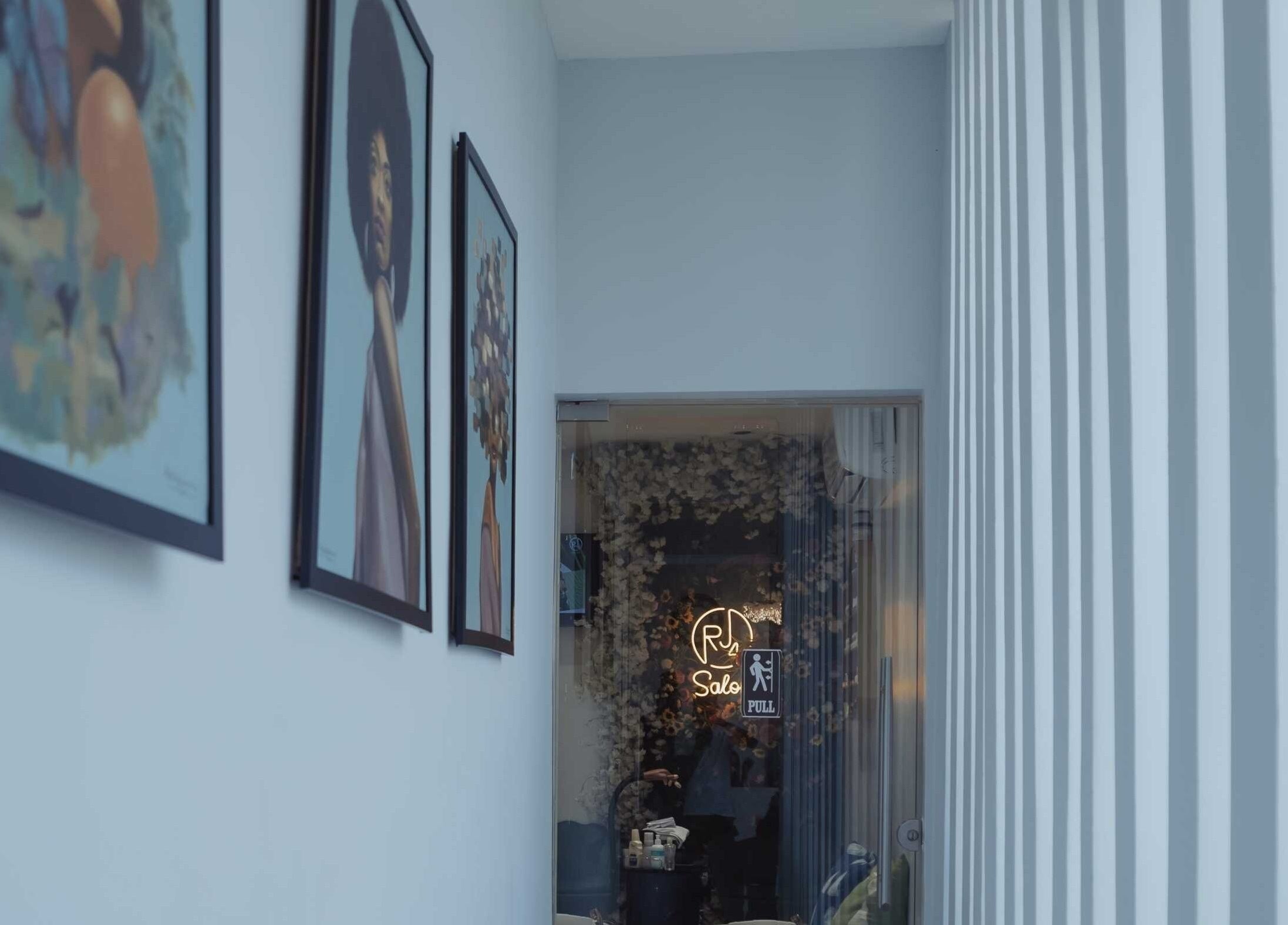 Entrance hallway of The Medspa at Rj4, Lagos, Lagos, NG, featuring modern art and sleek decor.