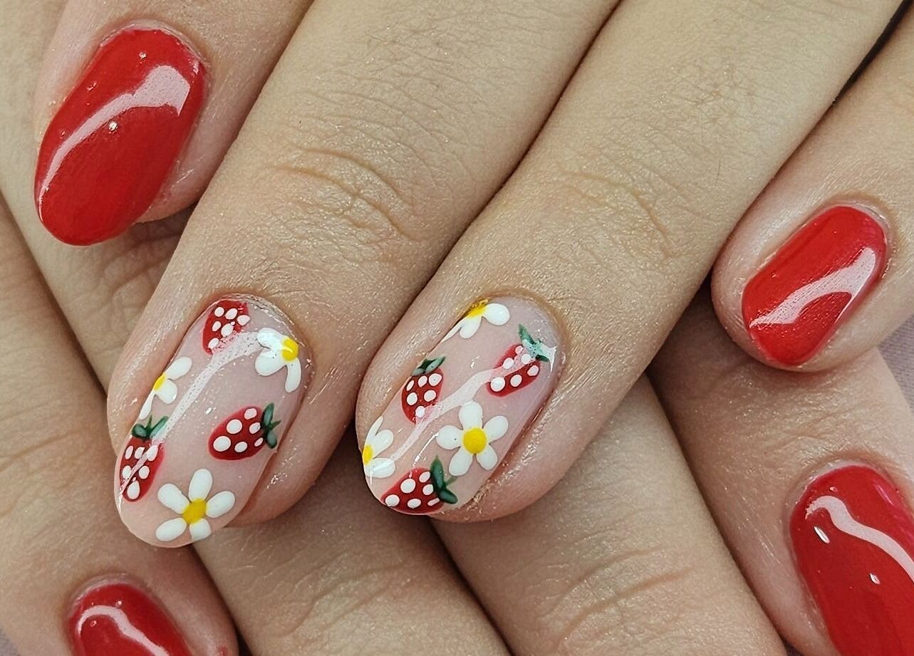 Vibrant strawberry nail art at Tamlyn Artistry in Waterfall, Kwazulu-natal, ZA. Perfect for fresh summer vibes.