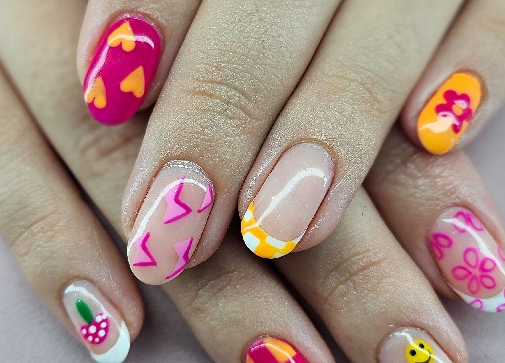 Colorful nail art by Tamlyn Artistry in Waterfall, Kwazulu-natal, ZA, showcasing vibrant designs.