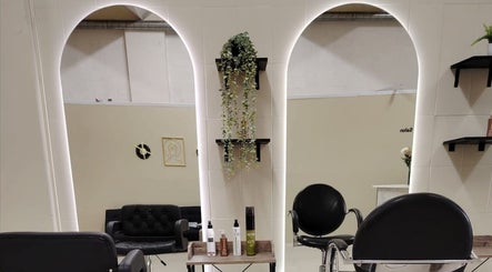 Elegant styling area at Nsix Hair Salon Plumstead in Cape Town, Western Cape, ZA with plush seating and mirrors.