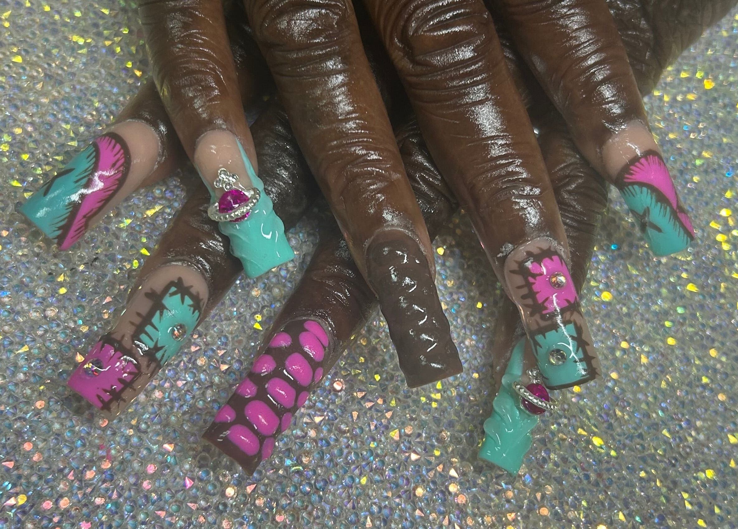 Colorful nail art with gems at Nails by Haylee in Virginia Beach, Virginia, US.