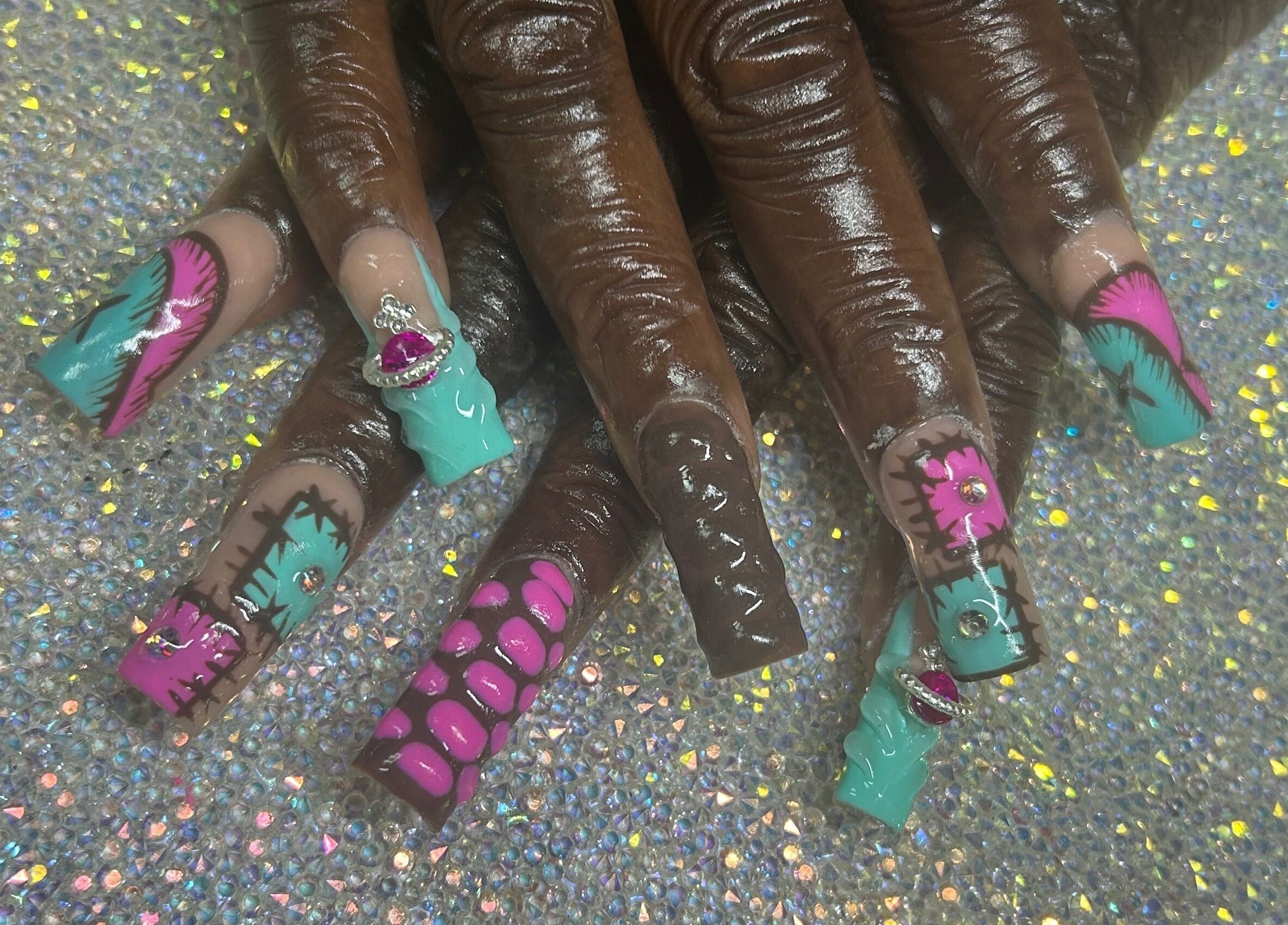 Colorful nail art with gems at Nails by Haylee in Virginia Beach, Virginia, US.