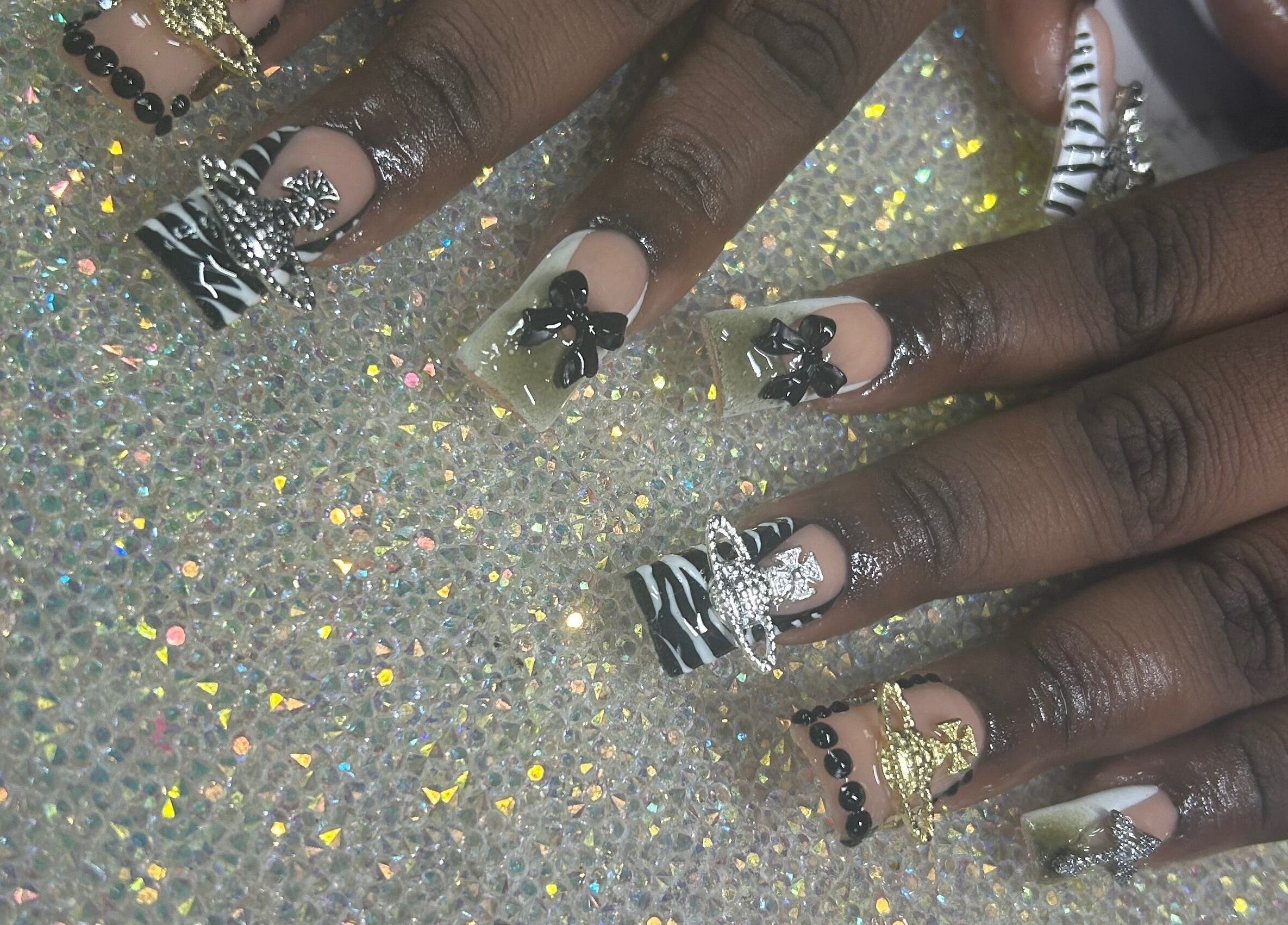 Intricate nail art with bows at Nails by Haylee, Virginia Beach, Virginia, US.