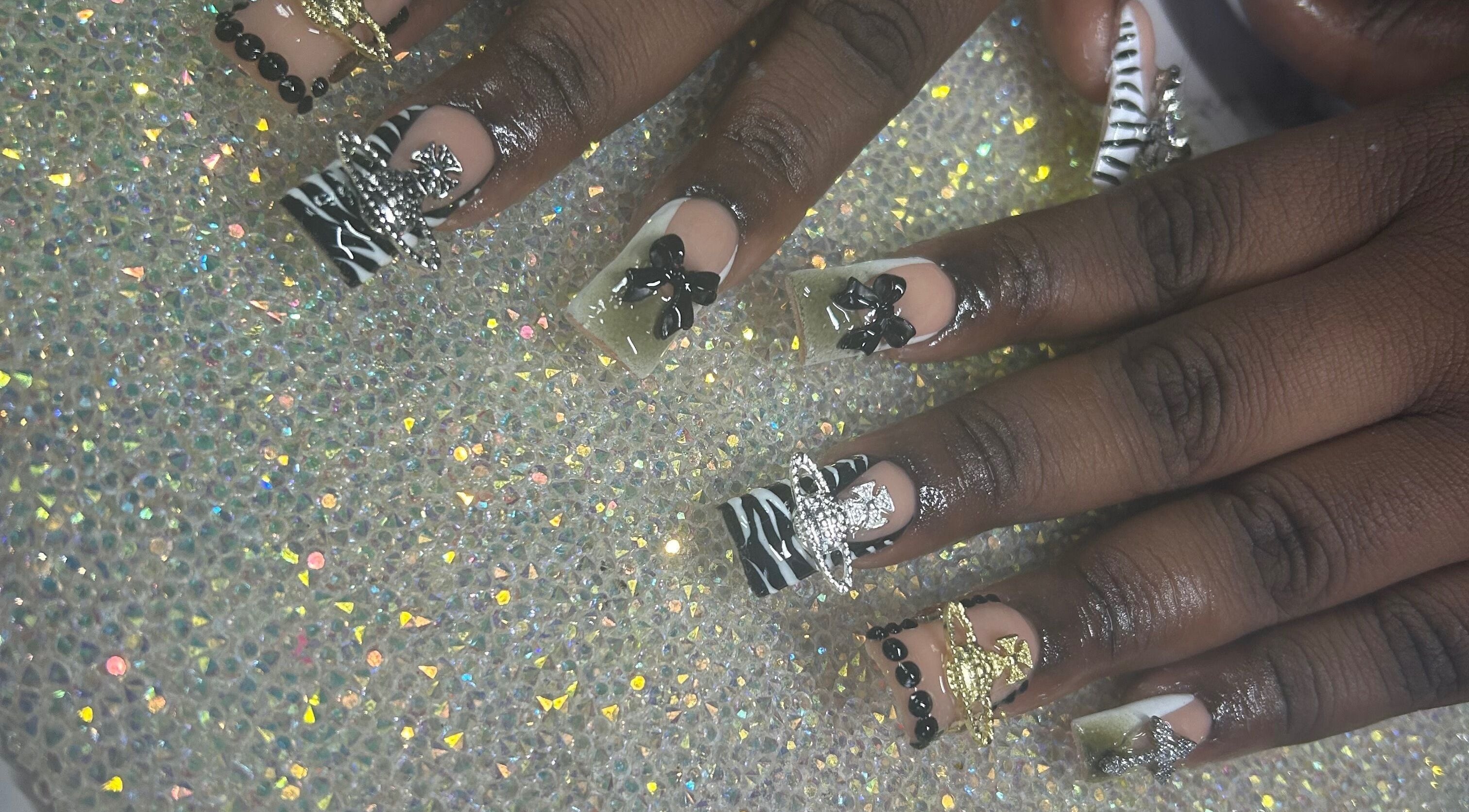 Intricate nail art with bows at Nails by Haylee, Virginia Beach, Virginia, US.