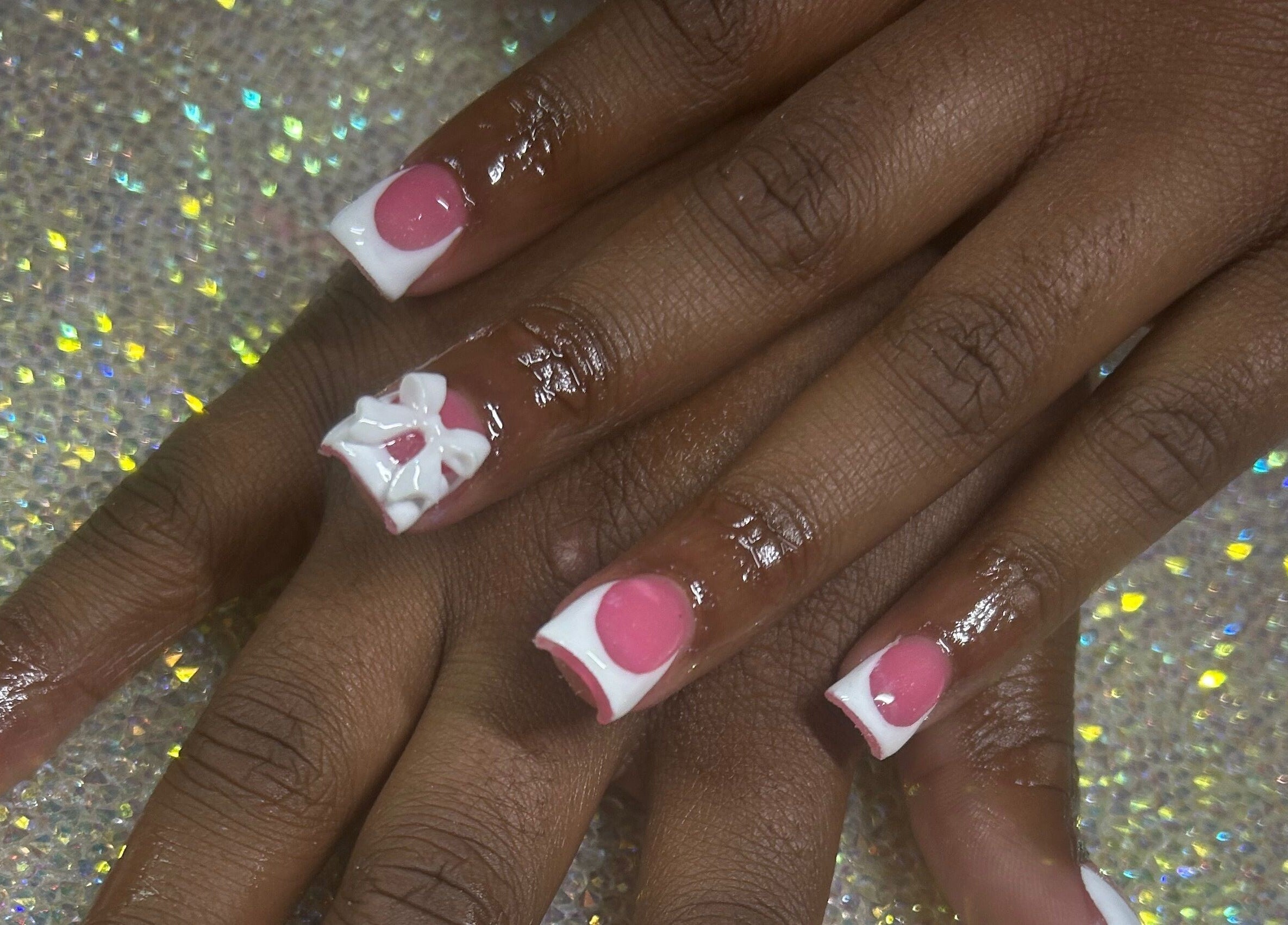 Stylish pink and white polka dot nails by Nails by Haylee in Virginia Beach, Virginia, US.