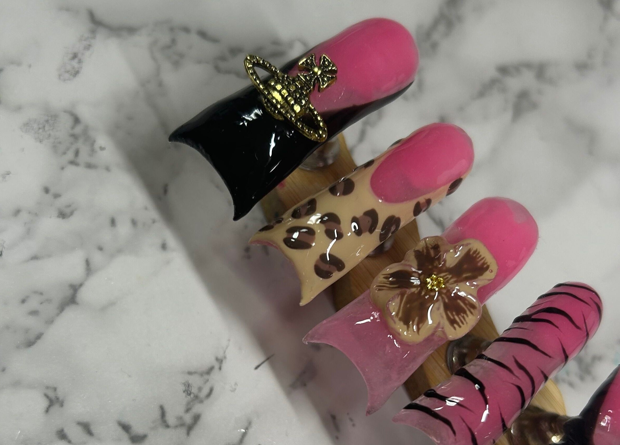 Elegant nail art designs with floral and leopard patterns at Nails by Haylee in Virginia Beach, Virginia, US.