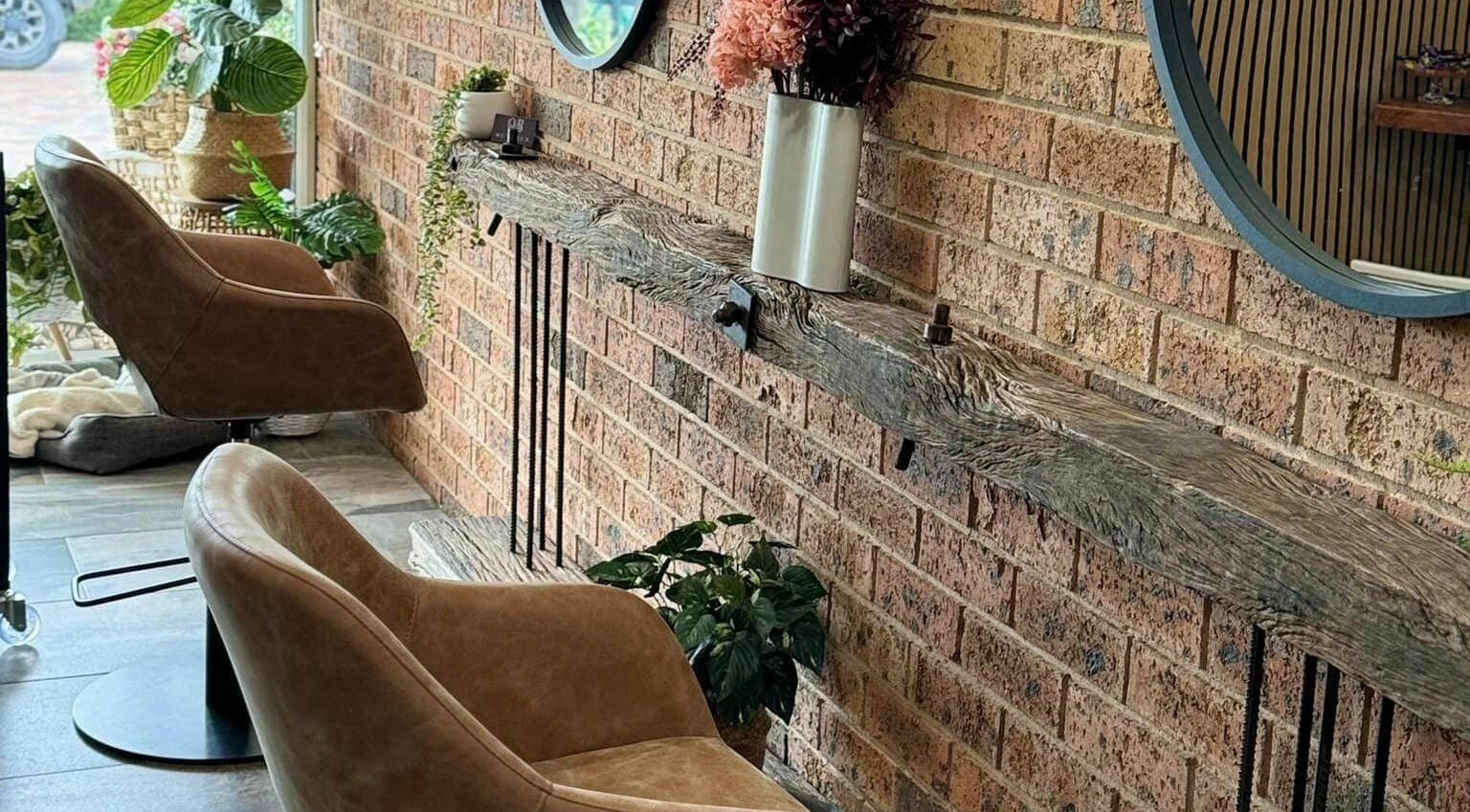 Rustic chic interior at Outback Hair & Beauty Goulburn in Goulburn, New South Wales, AU showcasing elegant chairs.