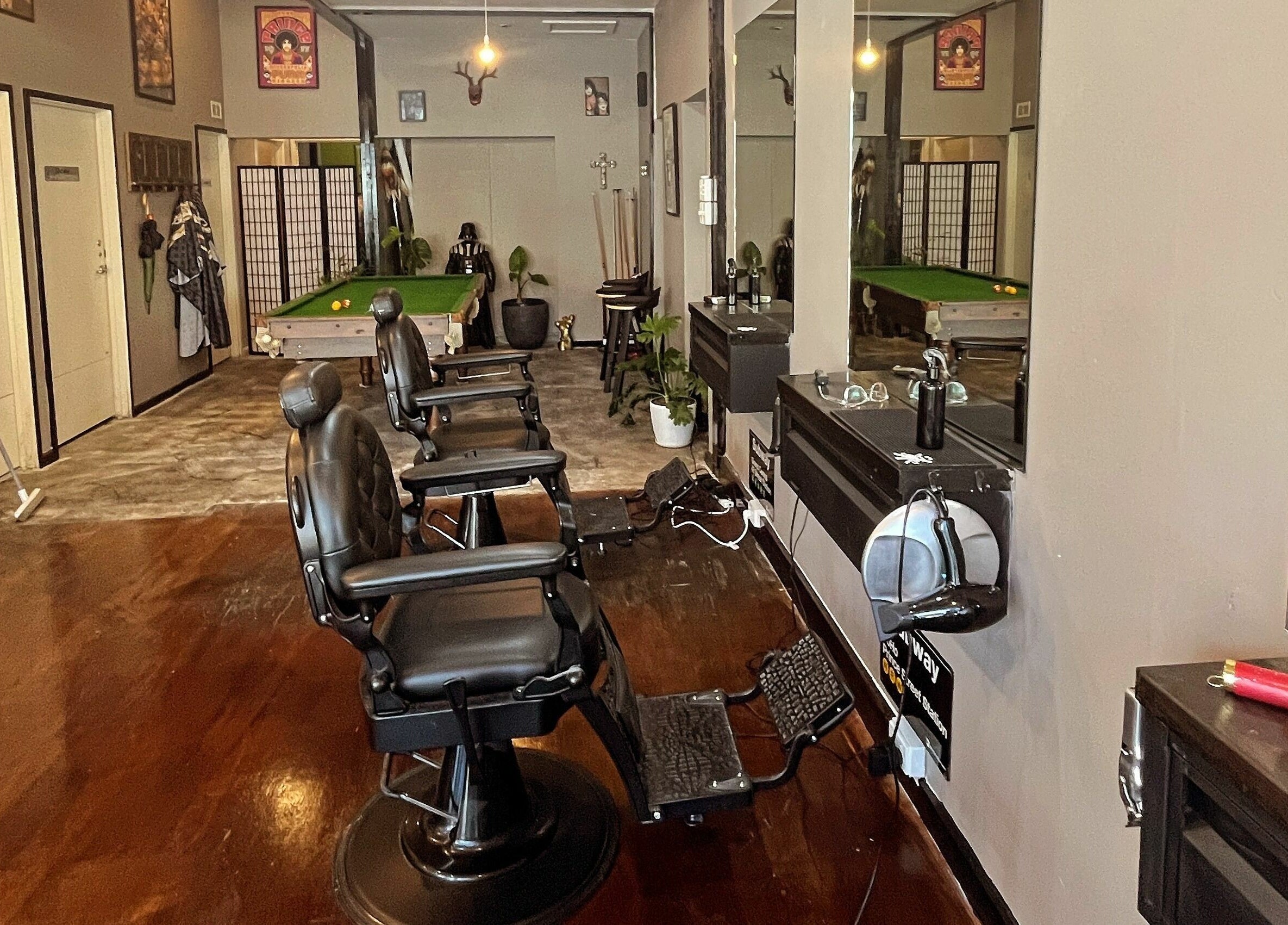 Interior of Chop Chop Barbers in Melbourne, Victoria, AU featuring sleek barber chairs and a pool table.