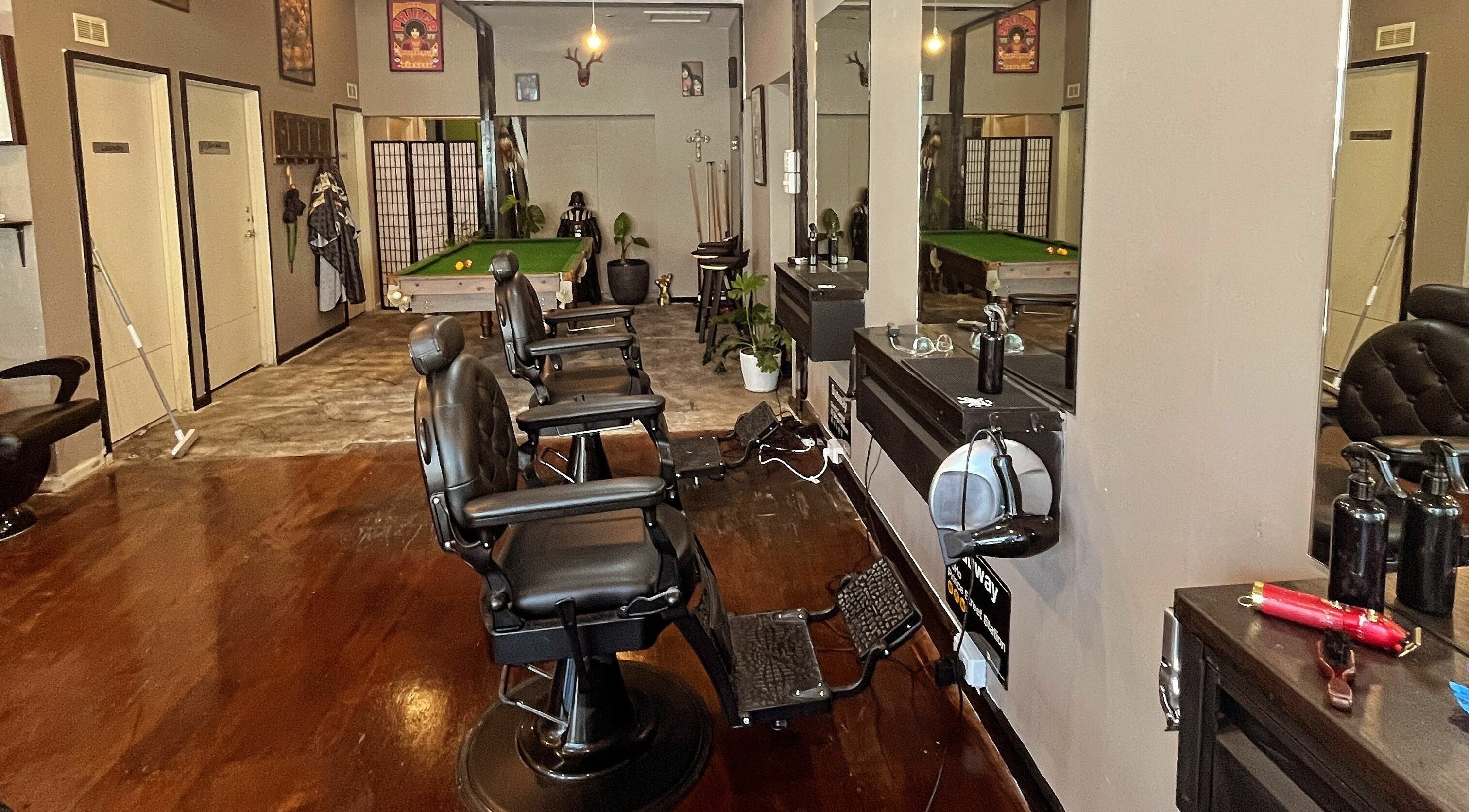 Interior of Chop Chop Barbers in Melbourne, Victoria, AU featuring sleek barber chairs and a pool table.