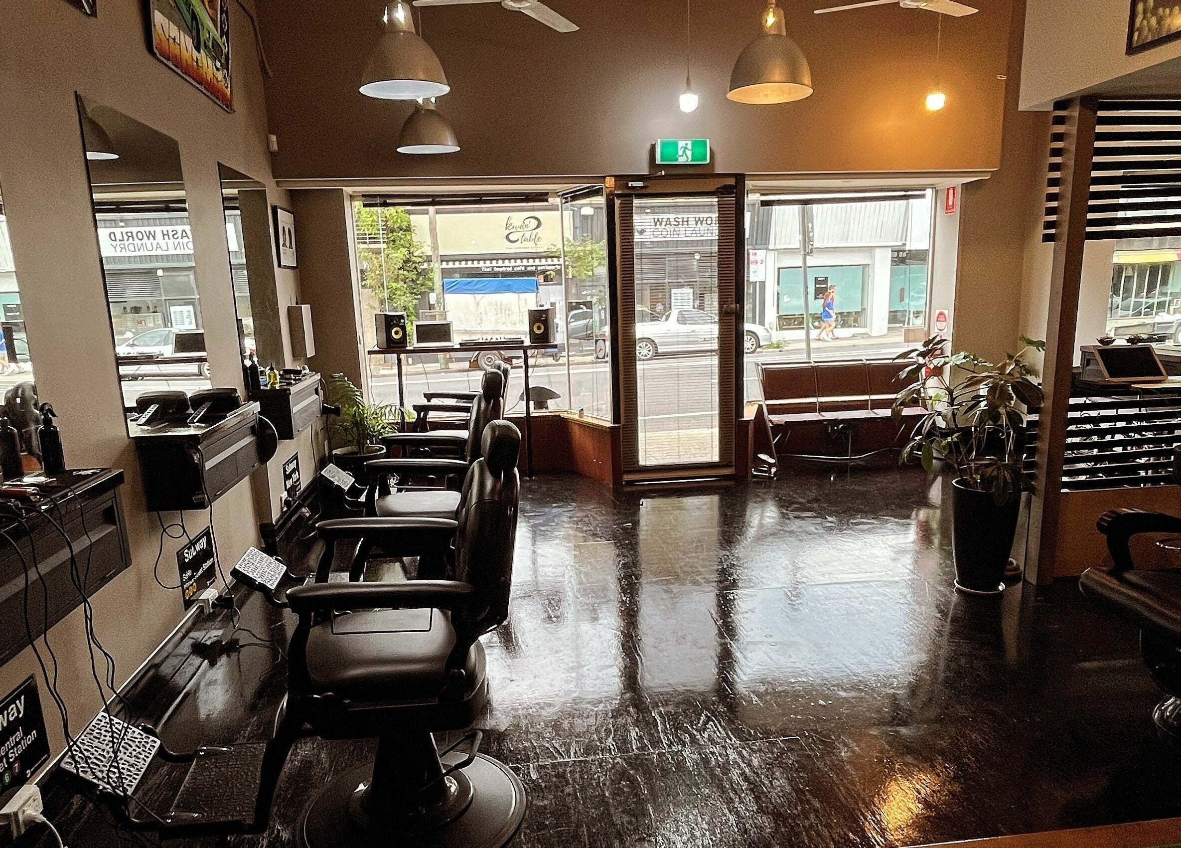 Stylish interior of Chop Chop Barbers in Melbourne, Victoria, AU, featuring sleek barber chairs and modern decor.