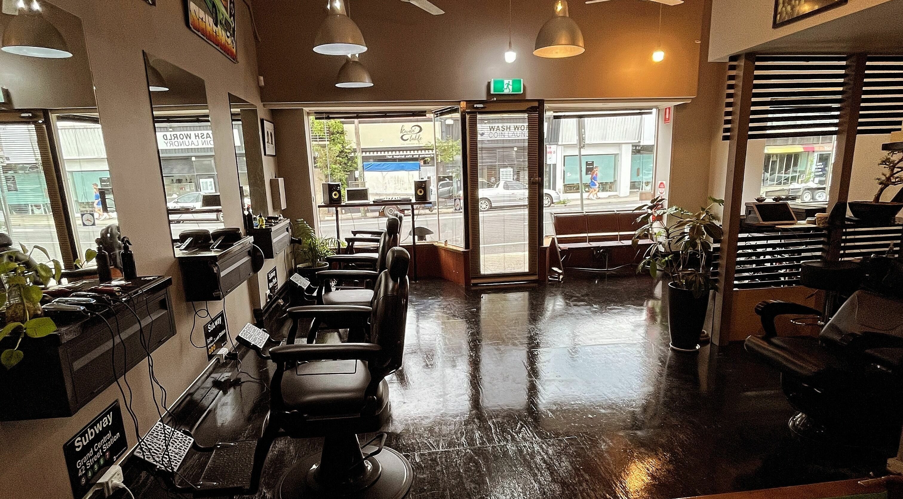 Stylish interior of Chop Chop Barbers in Melbourne, Victoria, AU, featuring sleek barber chairs and modern decor.