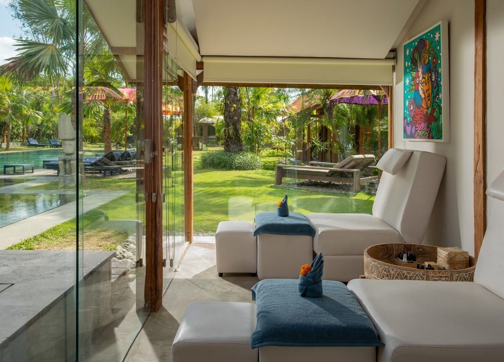Relaxation lounge at Heiwa Spa in Bali, Bali, ID, overlooking lush gardens and poolside seating.
