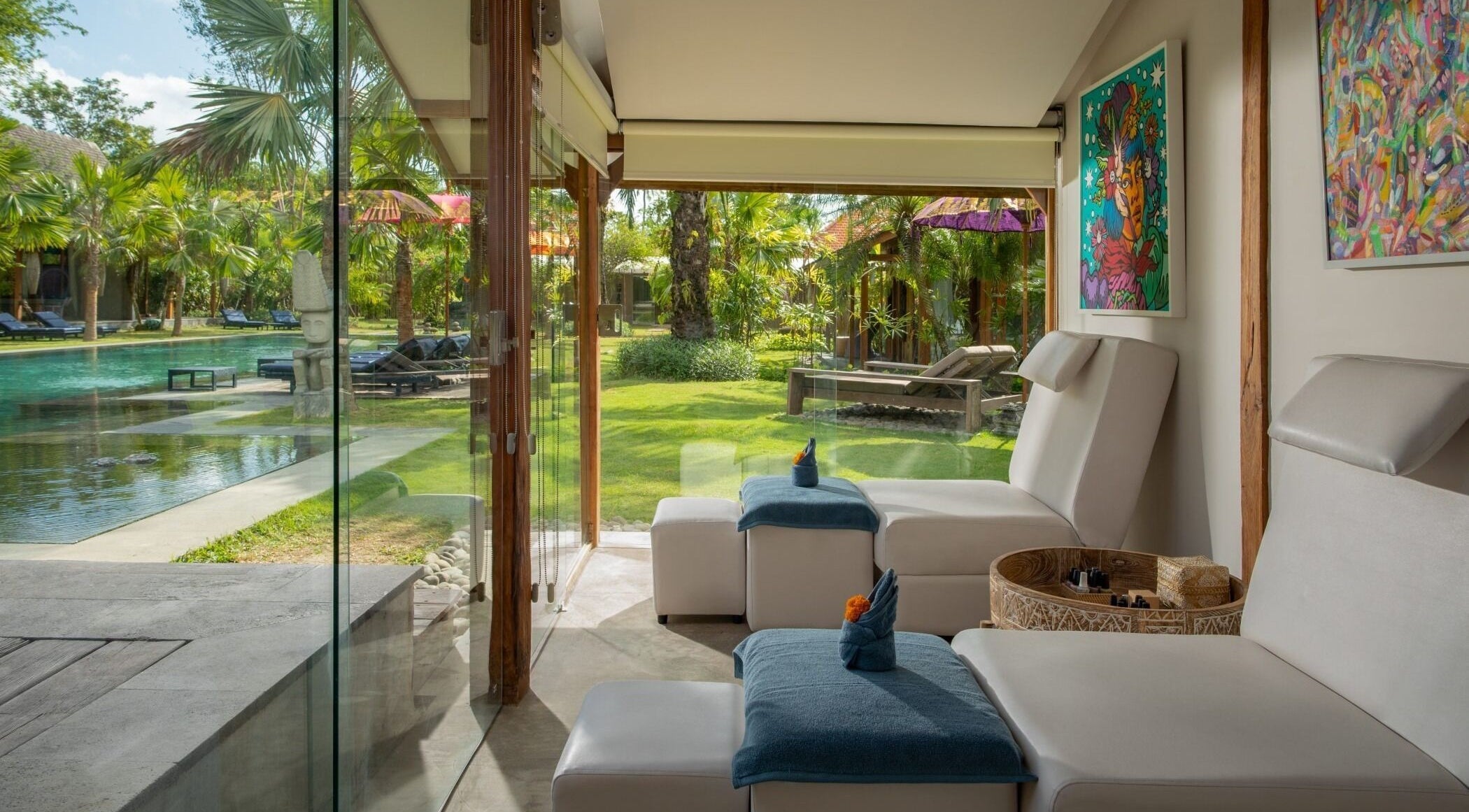 Relaxation lounge at Heiwa Spa in Bali, Bali, ID, overlooking lush gardens and poolside seating.