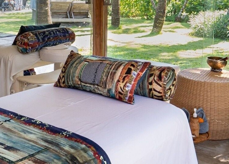 Relaxing spa beds at Heiwa Spa, Bali, Bali, ID, with lush garden views creating a serene environment.