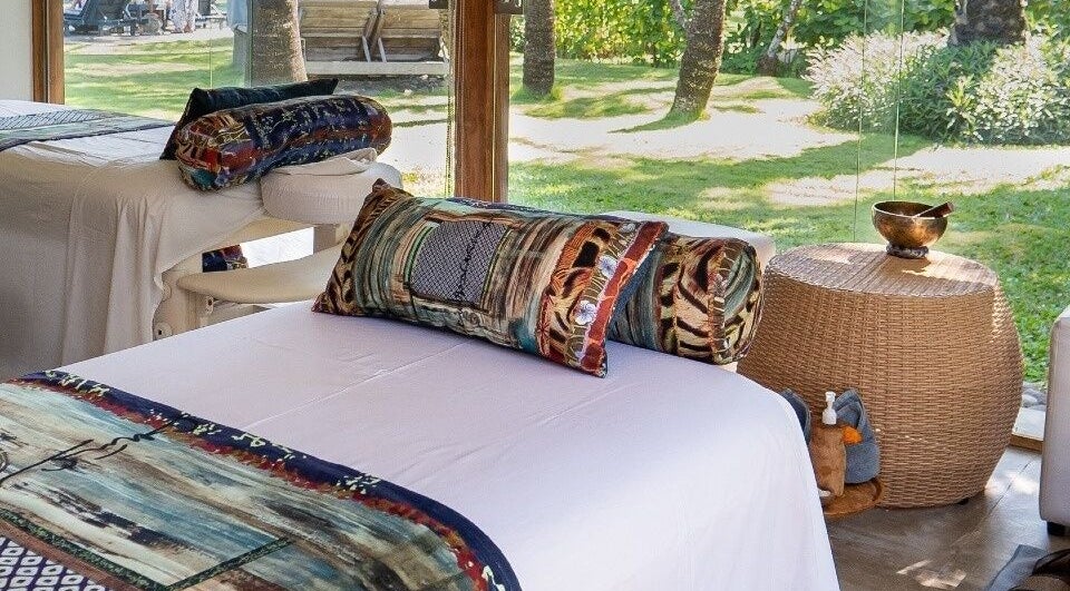 Relaxing spa beds at Heiwa Spa, Bali, Bali, ID, with lush garden views creating a serene environment.