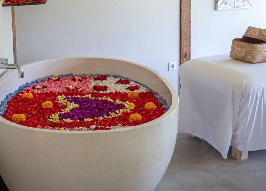 Luxurious flower-filled bath at Heiwa Spa, Bali, Bali, ID, perfect for relaxation and wellness.