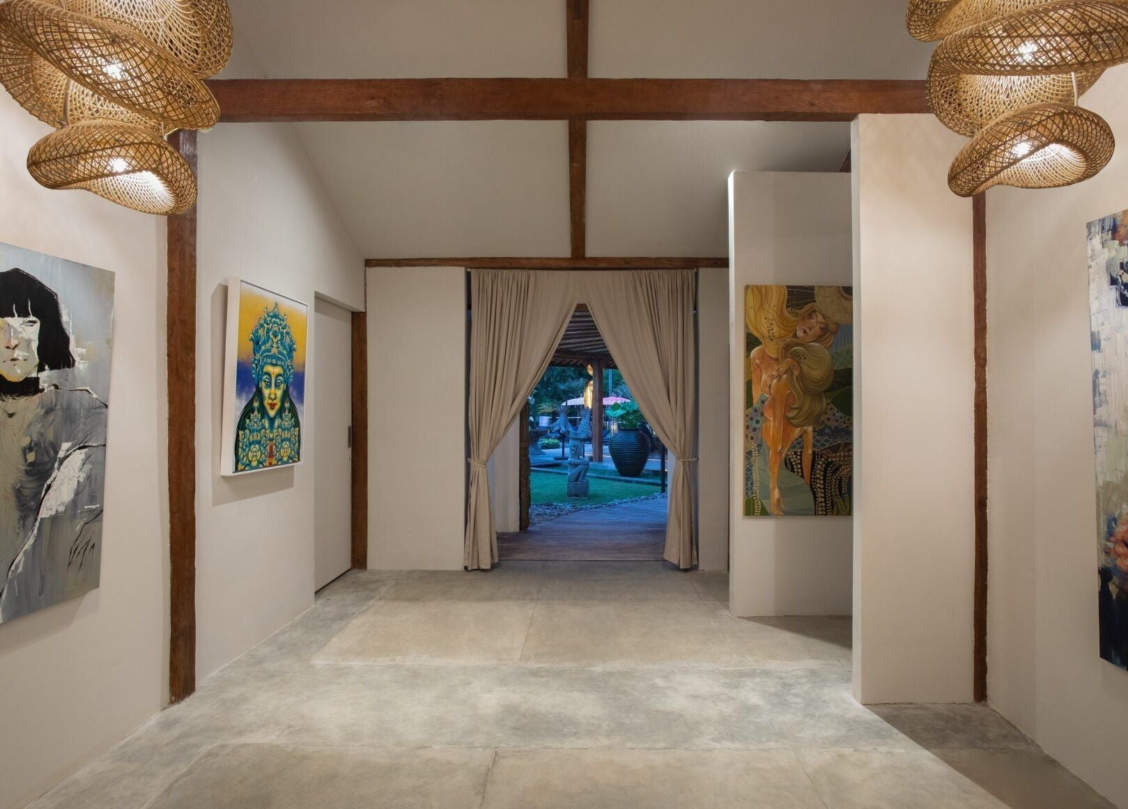 Art-filled corridor at Heiwa Spa in Bali, Bali, ID, showcasing captivating contemporary artworks.
