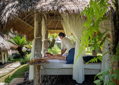 Relaxing outdoor massage at Flying Bamboo Spa, Bali, Bali, ID, showcasing tranquility and natural beauty.