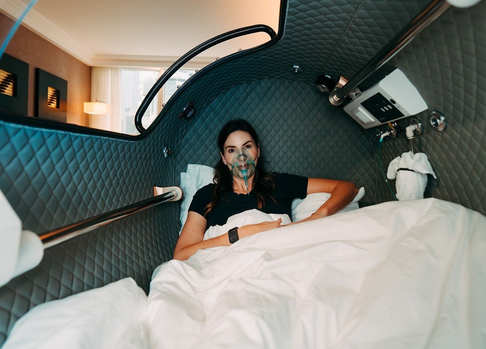 Woman in relaxation pod at 10x Longevity, Hong Kong Island, Hong Kong Island, HK, experiencing rejuvenation.