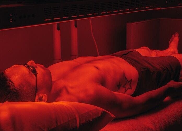 A person enjoys red light therapy at 10x Longevity on Hong Kong Island, Hong Kong Island, HK.