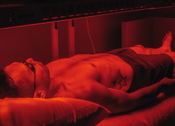 A person enjoys red light therapy at 10x Longevity on Hong Kong Island, Hong Kong Island, HK.