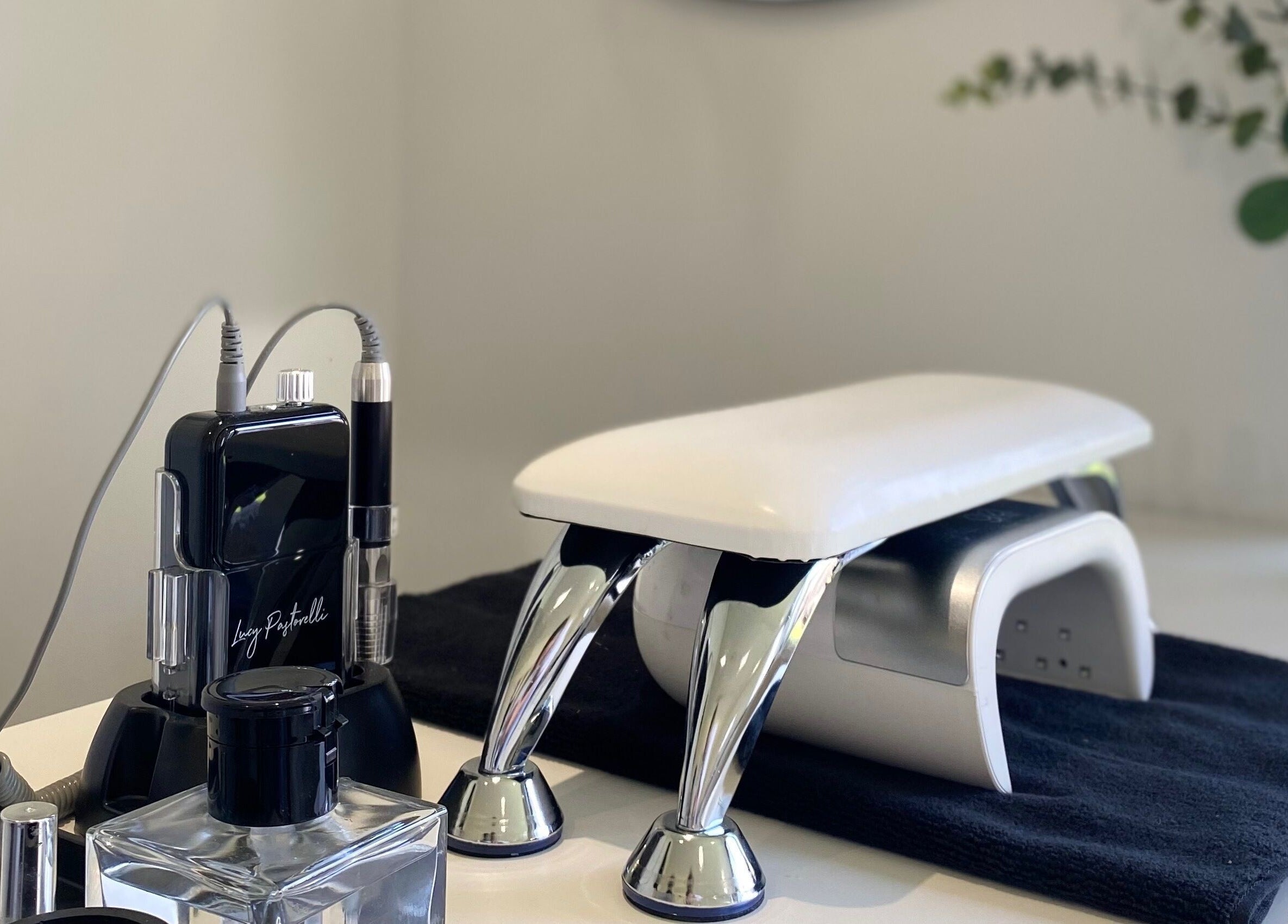 Manicure station at Elevate Lashes, Berkhamsted, England, GB with modern nail equipment.