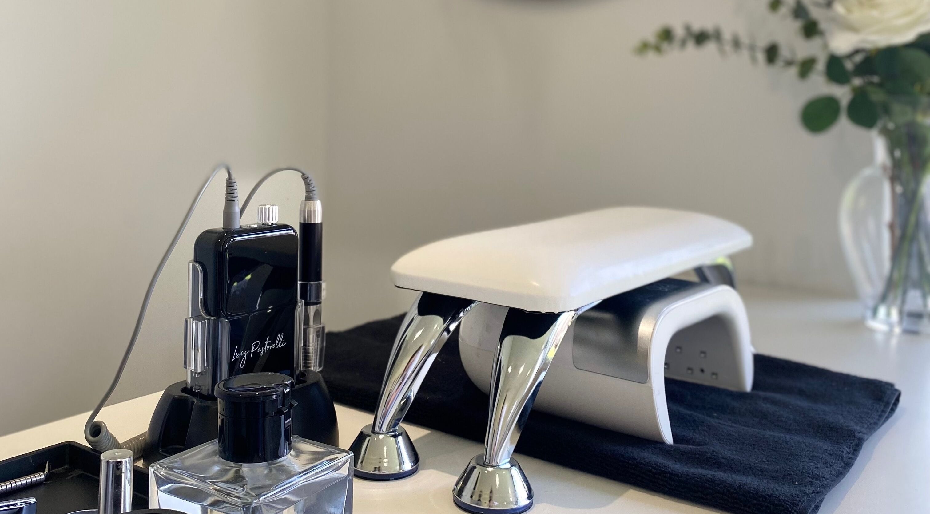 Manicure station at Elevate Lashes, Berkhamsted, England, GB with modern nail equipment.