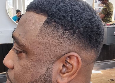 Close-up of a stylish haircut at So Fresh Afro Barber, Bolton, England, GB, showcasing expert fade skills.