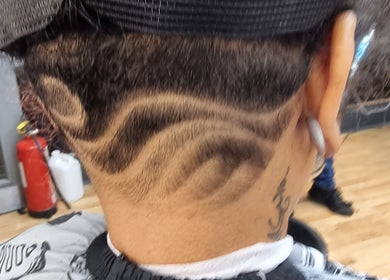 Unique hair design at So Fresh Afro Barber, Bolton, England, GB. Showcasing artistic barbering skills.