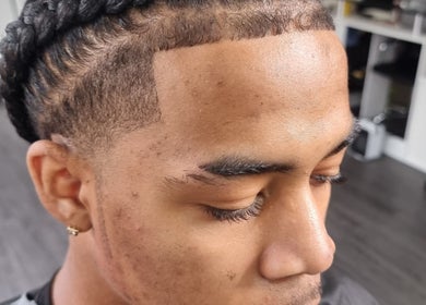 Close-up of a neatly braided hairstyle at So Fresh Afro Barber, Bolton, England, GB.