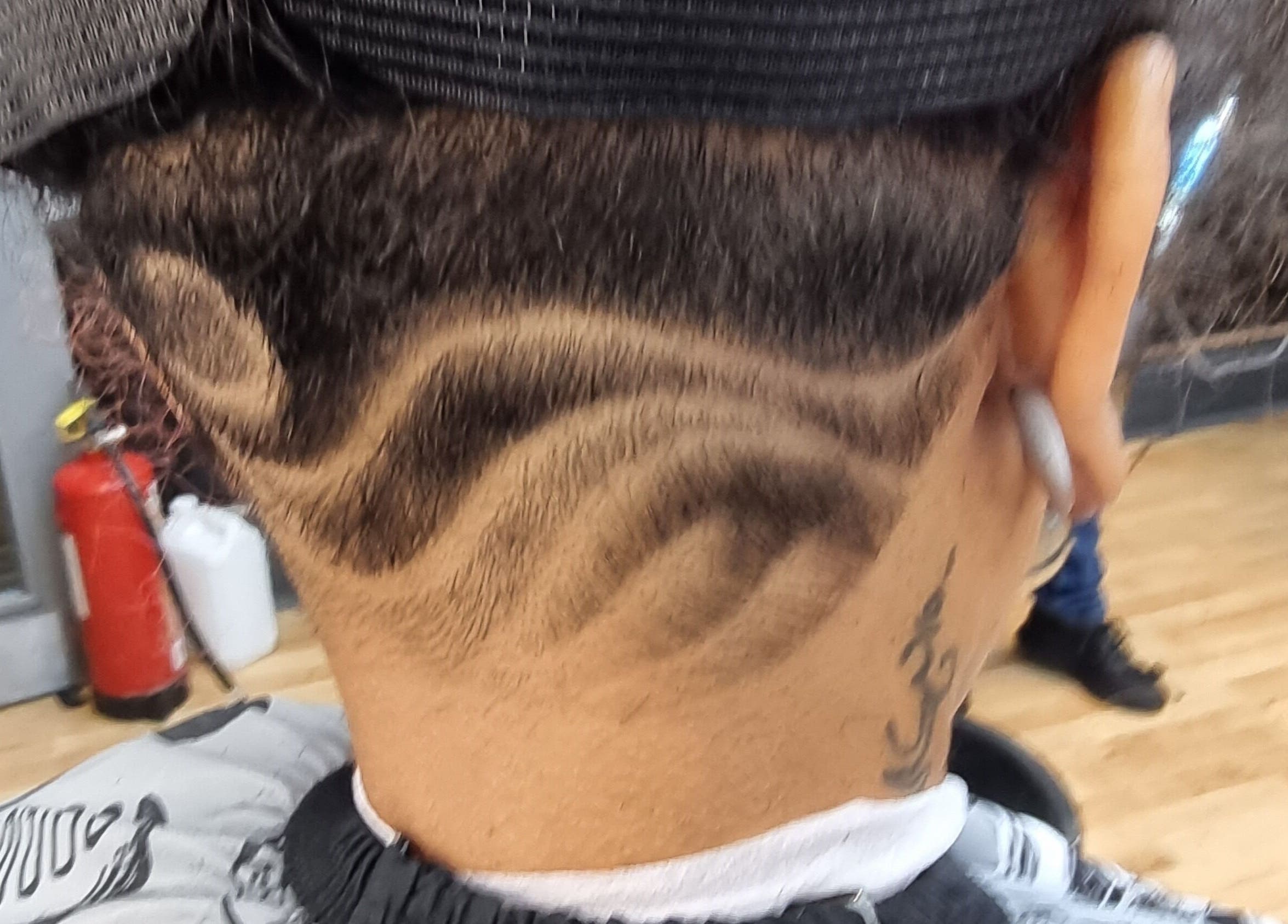 Creative hair design at So Fresh Afro Barber in Bolton, England, GB showcasing intricate patterns.