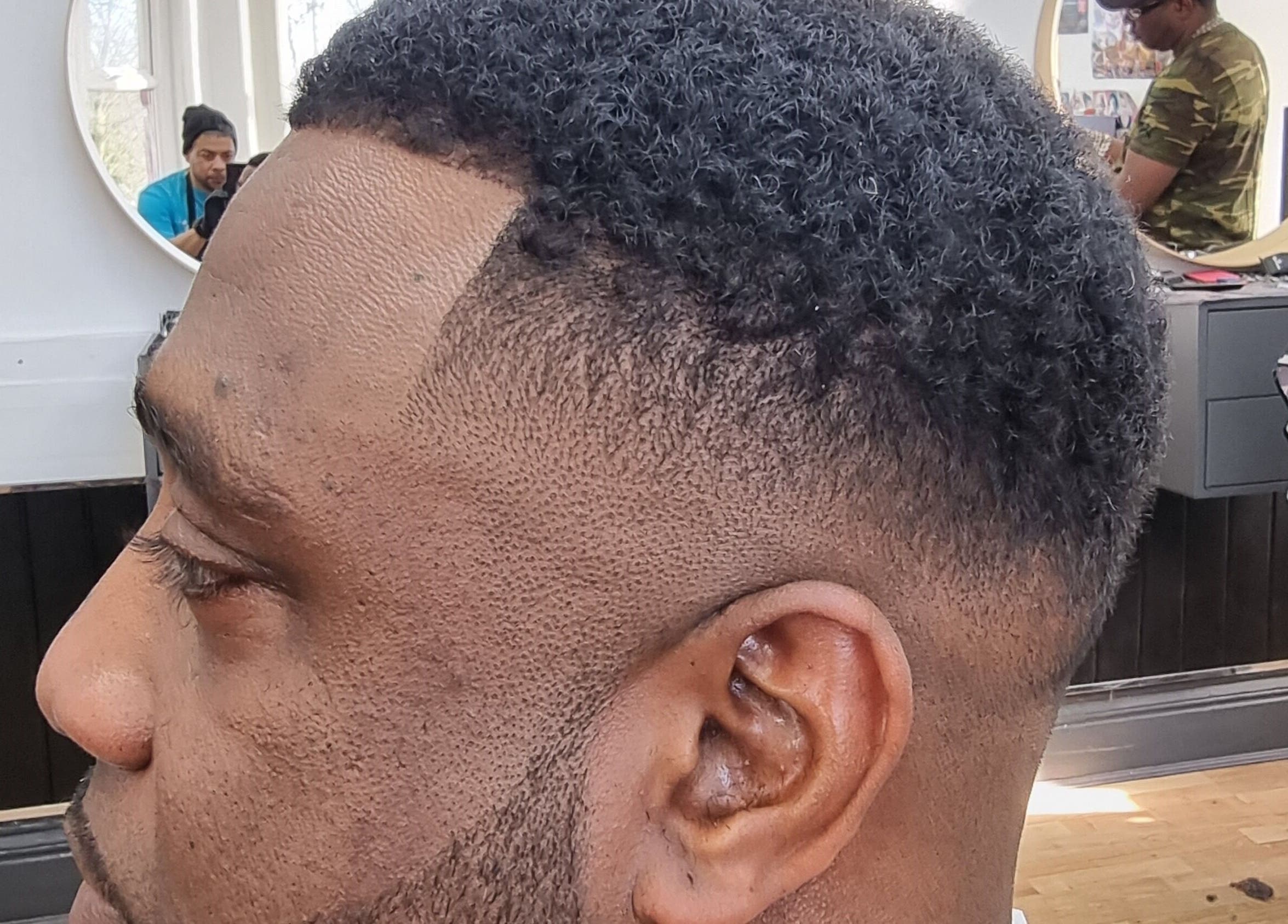 Close-up of a precision fade haircut at So Fresh Afro Barber in Bolton, England, GB, showcasing expert craftsmanship.