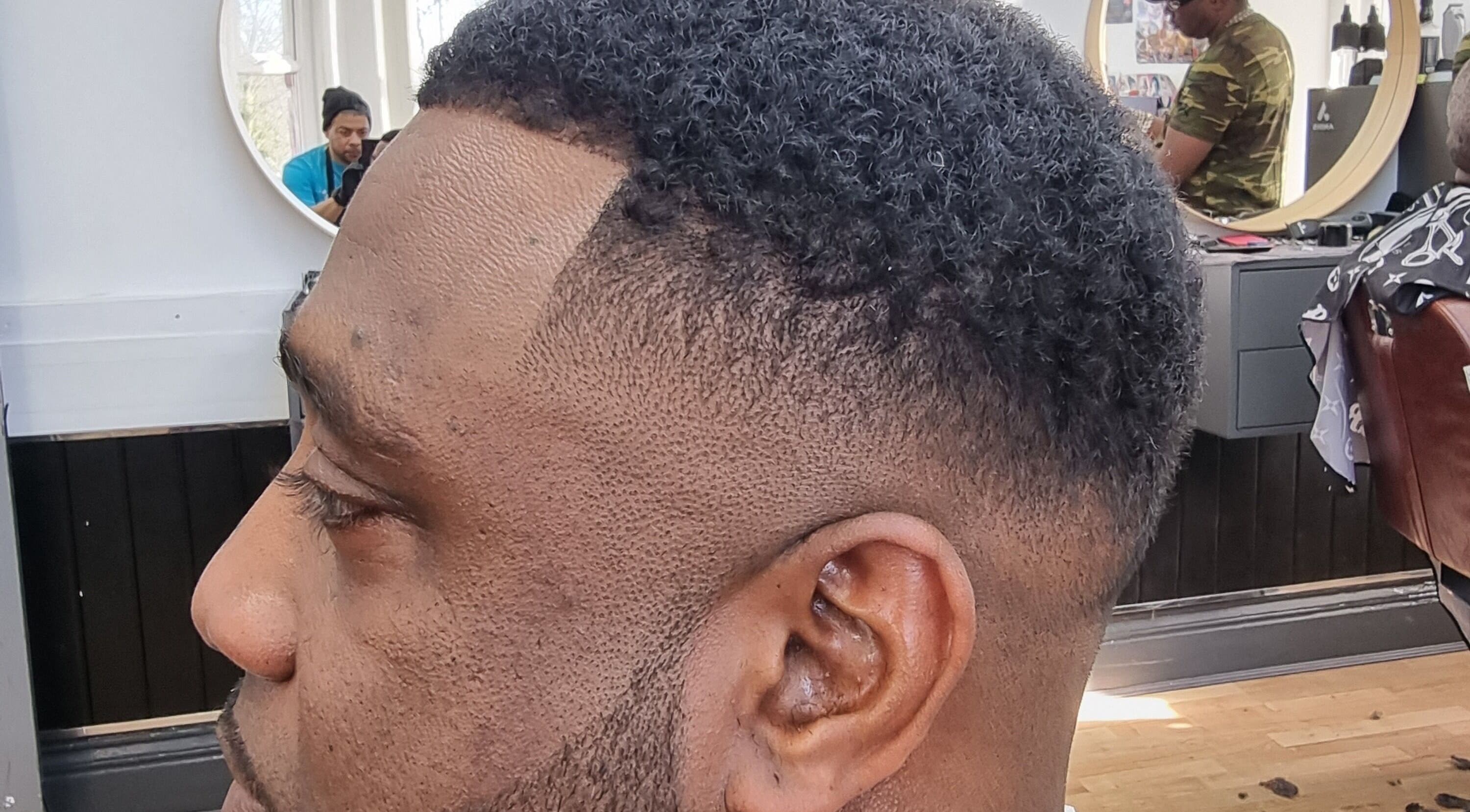 Close-up of a precision fade haircut at So Fresh Afro Barber in Bolton, England, GB, showcasing expert craftsmanship.