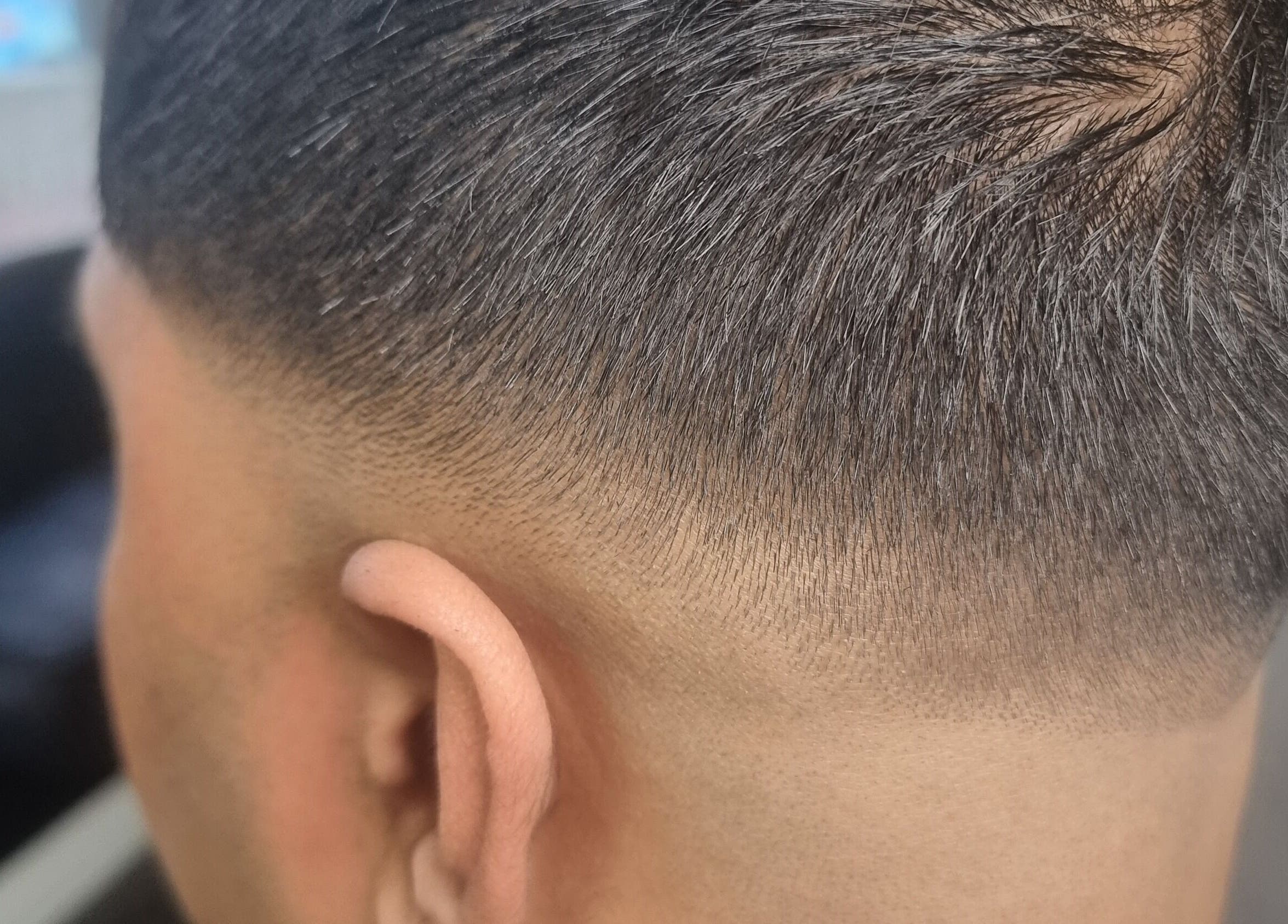 Close-up of a precise fade haircut at So Fresh Afro Barber in Bolton, England, GB, showcasing expert skill.