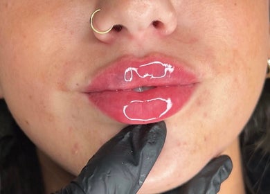 Closeup of glossy lips at LUMI AESTHETICS, Pudsey, England, GB, showcasing beauty treatment results.