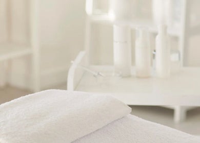 Luxurious spa setting at Sultan Beauty, Melbourne, Victoria, AU with plush towels and serene decor.